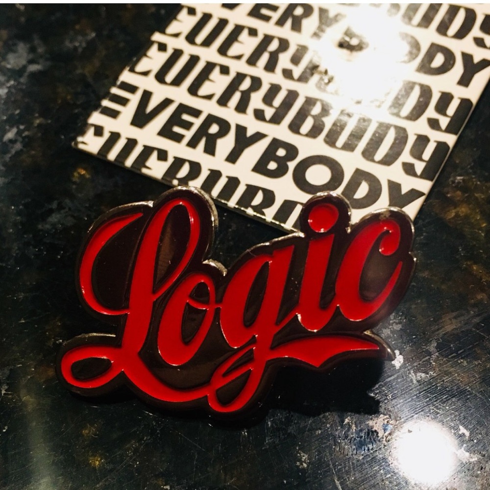Logic enamel pin